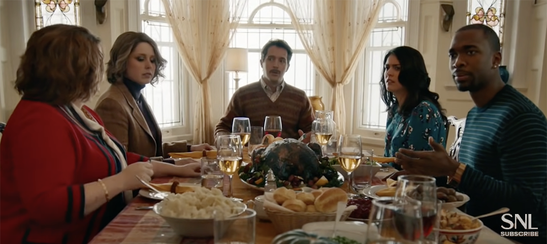 Unhappy family sitting around a Thanksgiving dinner table